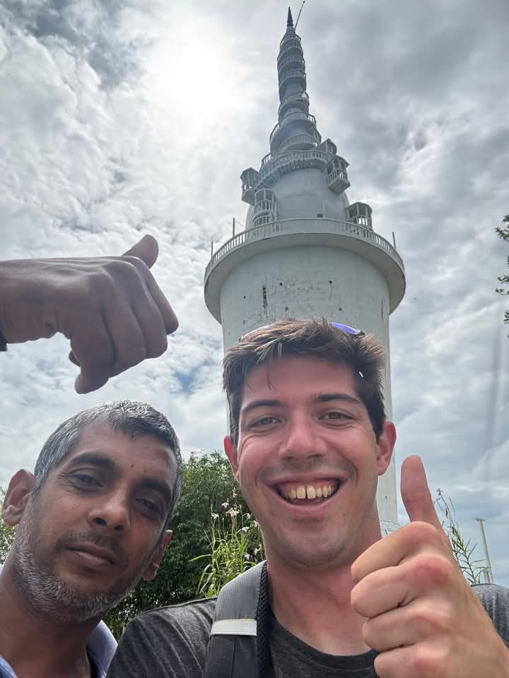 Asanka and a traveler at the top of Ambuluwawa Tower near Kandy