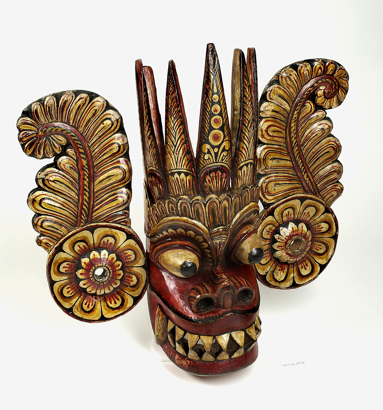 Hand-carved traditional Sri Lankan wooden mask from a Kandyan artisan workshop